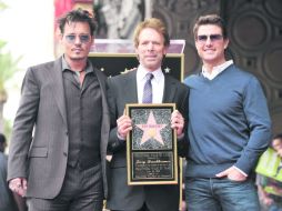 Johnny Depp, Jerry Bruckheimer y Tom Cruise fueron el blanco de las miradas en la ceremonia de entrega. AP /