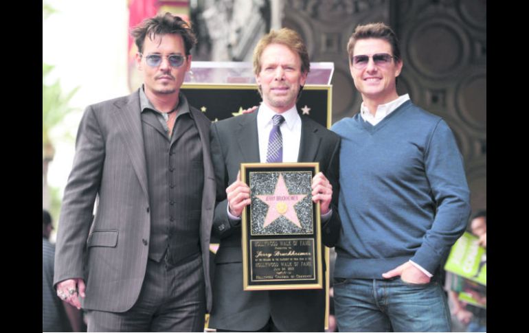 Johnny Depp, Jerry Bruckheimer y Tom Cruise fueron el blanco de las miradas en la ceremonia de entrega. AP /