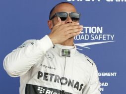 Lewis apunta que gracias al trabajo de su equipo y la 'pole' obtenida es una gran recompensa para su esfuerzo. AFP /