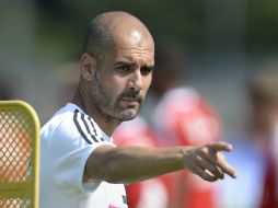 Para Josep Guardiola, todo está en calma dentro del futbol español. AFP /