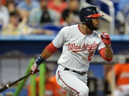 El guardabosques logra remolcar al parador en corto Ian Desmond con la carrera del triunfo. AFP /