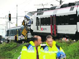 Acciones. Peritos investigan en el sitio del accidente. AFP /