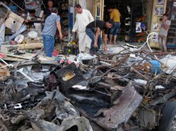 Al menos ocho coches bomba y varios artefactos explosivos estallan en diferentes barrios de la ciudad. AP /