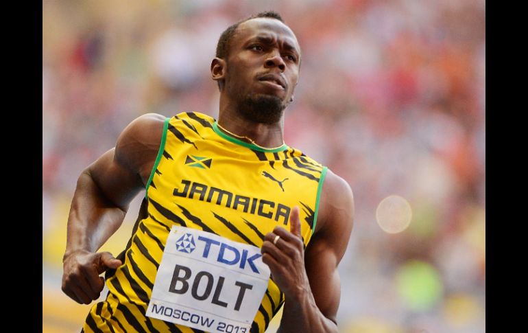 Bolt busca tres títulos en Moscú 2013. AFP /