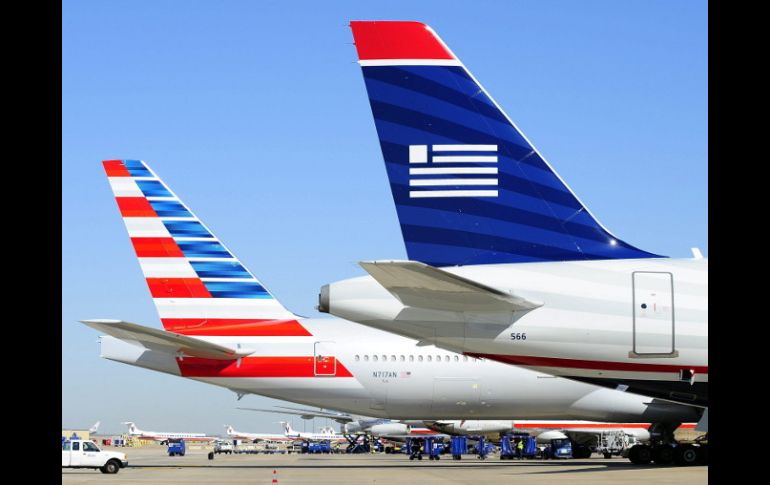 El Departamento de Justicia de EU presenta una demanda contra la fusión entre las aerolíneas American Airlines y US Airways. EFE /