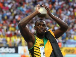 En caso de vencer este domingo en relevo 4x100, Bolt superaría al mítico Carl Lewis como líder del medallero histórico. AFP /