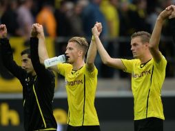 Marco Reus y sus compañeros celebran la victoria ante el recién ascendido Eintracht Braunschweig. AFP /