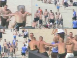 Imagen de las cámaras de seguridad de la playa Gdynia donde se pueden ver hasta ocho ''hooligans'' golpeando a un marino. ESPECIAL /