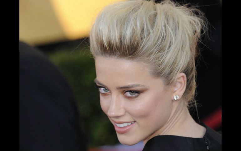 Amber Heard declaró prefiere mantener en lo privado su romance con Johnny Depp. ARCHIVO /