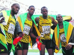 De la mano de Bolt (tercero de izq. a derecha) Jamaica cosechó una cifra récord de 12 medallas, su mayor ganancia en un Mundial. AP /