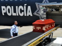 Los restos de los fallecidos fueron trasladados a la ciudad hondureña de San Pedro Sula en un avión de la Policía Federal. AFP /