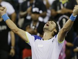 David Ferrer celebra luego de que terminara el partido contra Janko Tipsarevic. AP /