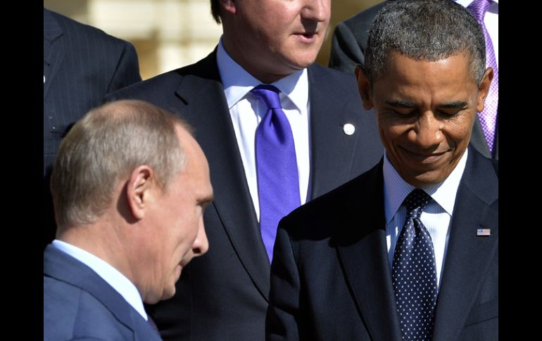 Putin charla con Obama, durante la cumbre del G-20. AFP /