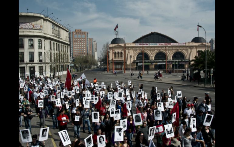 Familiares de la represión portaban unas dos mil fotografías de detenidos y  desaparecidos. AFP /