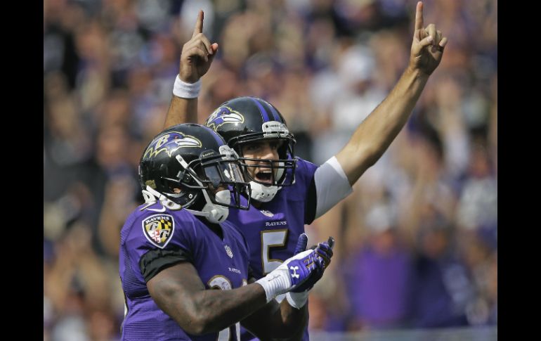 Joe Flacco (5) tuvo una actuación discreta pero efectiva en la victoria de los Cuervos. AP /