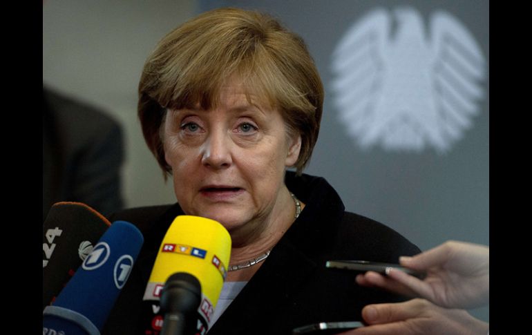 Se estima que Angela Merkel logrará este domingo una clara ventaja sobre sus rivales. ARCHIVO /