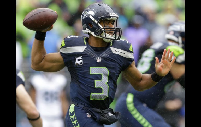 Russell Wilson empató una marca de por vida lanzando cuatro pases de anotación ante Jacksonville. AP /