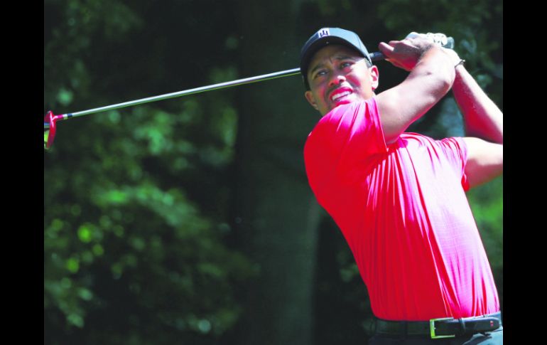 Tiger Woods finalizó el domingo con 67 golpes para culminar en el sitio 22 en East Lake, su peor resultado en ese campo. AFP /