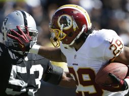 Washington se recuperó de una desventaja de 14 puntos para imponerse a los Raiders. AP /