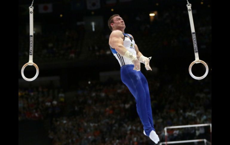 A Arthur Zanetti le siguen el ruso Aleksandr Balandin, que se llevó la plata y Brandon Wynn, de EU, con el bronce. AP /