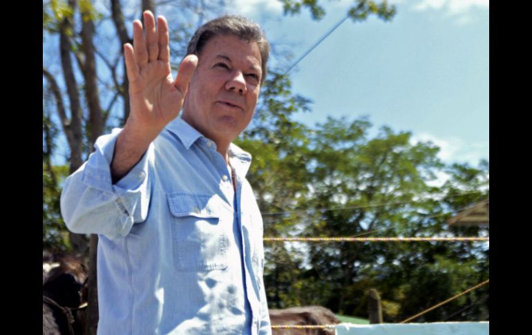 Juan Manuel Santos expresa su confianza de llegar a un acuerdo a un año de comenzar con los Diálogos de Paz. AFP /