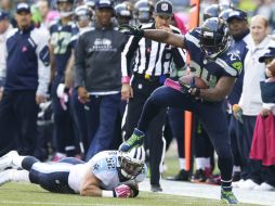 Marshawn Lynch (24) fue el motor ofensivo de Seattle. AP /