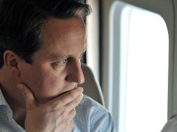 Cameron, uno de los aliados más firmes de EU, no ha criticado el escándalo del espionaje telefónico. ARCHIVO /