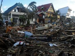 Hasta el momento autoridades confirman que hay 10 mil muertos en Filipinas. AFP /