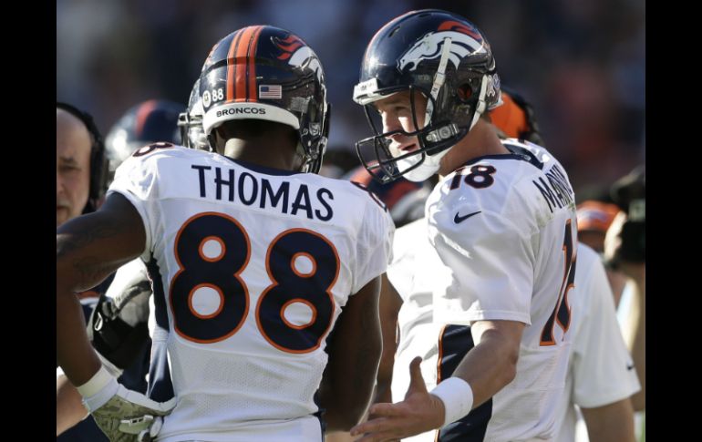 Peyton Manning y Demaryius Thomas se conectaron para tres anotaciones. AP /