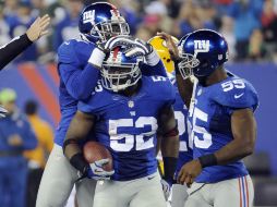 Los jugadores de los Gigantes de Nueva York celebran su victoria. AP /