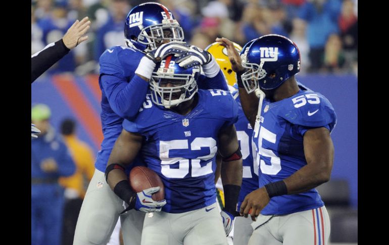 Los jugadores de los Gigantes de Nueva York celebran su victoria. AP /