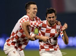 Los de Croacia festejan su pase a la próxima copa del mundo. AFP /