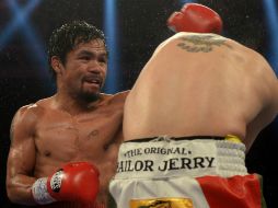 Manny 'Pacman' Pacquiao dedicó su triunfo a las víctimas del tifón Haiyan. AP /