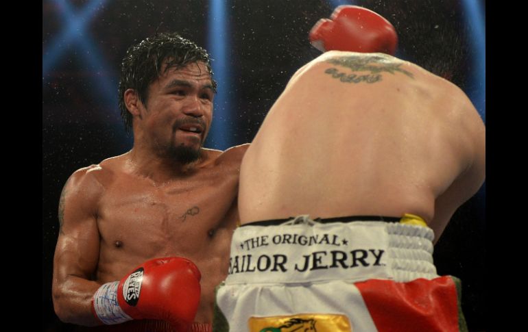 Manny 'Pacman' Pacquiao dedicó su triunfo a las víctimas del tifón Haiyan. AP /