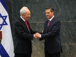 El presidente le dió la bienvenida con una ceremonia y ofrecerá una cena en honor del mandatario israelí. AP /