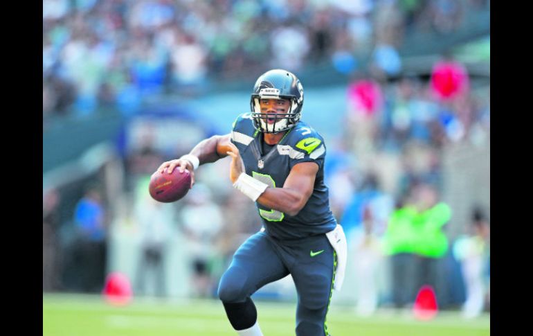 Russell Wilson destacó en la generación 2012 de los QB novatos, junto a Andrew Luck, de los Colts. AP /