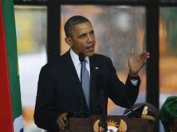 Barack Obama es uno de los mandatarios que dirigió un mensaje durante la ceremonia en honor a Mandela en el estadio Soccer City. AFP /