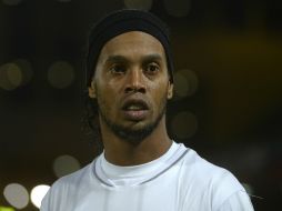 Ronaldinho no podrá reencontrarse con su ex entrenador Pep Guardiola. AFP /