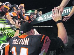 Andy Dalton es querido en casa, aunque aún no gana en postemporada para los Bengalíes. AP /