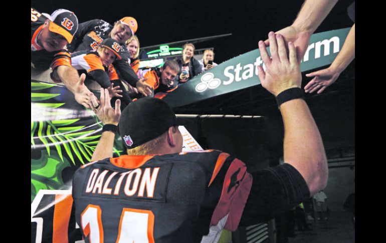 Andy Dalton es querido en casa, aunque aún no gana en postemporada para los Bengalíes. AP /