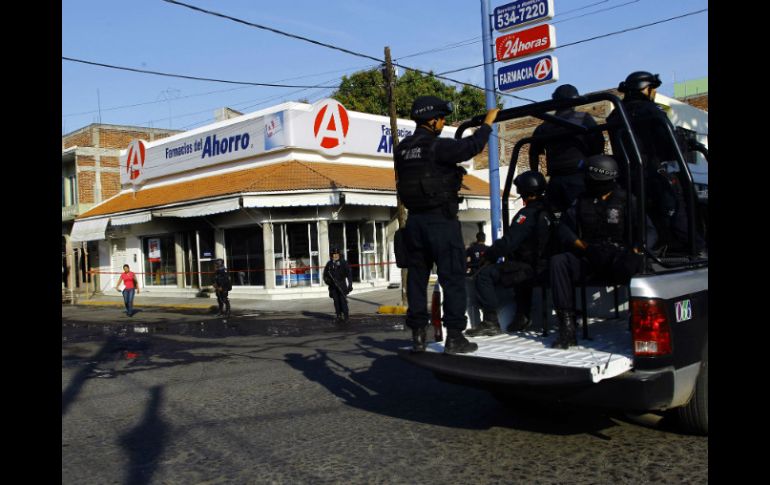 El incendio en una farmacia del municipio michoacano no tuvo ninguna persona herida, pero si el reforzamiento de la vigilancia. AFP /