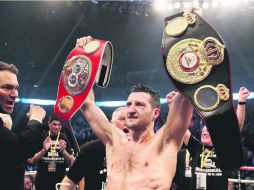 Froch defendió con éxitos sus coronas del peso Supermedio de la AMB y FIB ante George Groves. ESPECIAL /