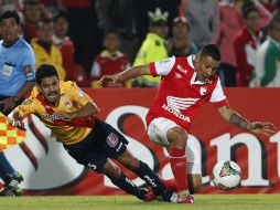 Acción de juego entre Francisco Acuña (i) y Luis Arias. AP /