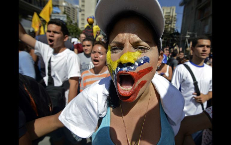 En la imagen, estudiantes manifestándose en Venezuela. AFP /
