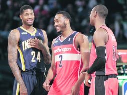 Paul George, de Indiana; John Wall, de Washington, y Terrence Ross, de Toronto ganaron el Concurso de Clavadas. AP /