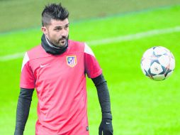 Concentrado.  El 'Guaje' Villa y el Atlético de Madrid por la primera parte del boleto. EFE /