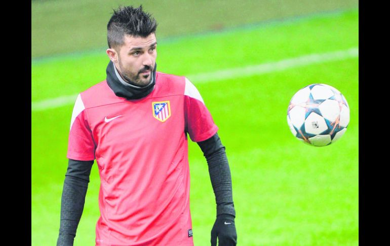 Concentrado.  El 'Guaje' Villa y el Atlético de Madrid por la primera parte del boleto. EFE /