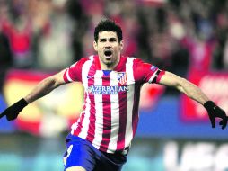 Por la puerta grande. El delantero hispano-brasileño del Atlético de Madrid, Diego Costa, abrió y selló el marcador para los colchonero AFP /