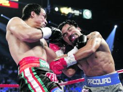 Las cuatro peleas entre Márquez y Pacquiao han quedado ya grabadas en los libros de historia del boxeo. AP /