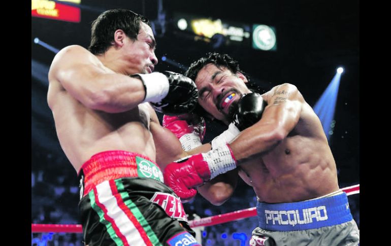 Las cuatro peleas entre Márquez y Pacquiao han quedado ya grabadas en los libros de historia del boxeo. AP /